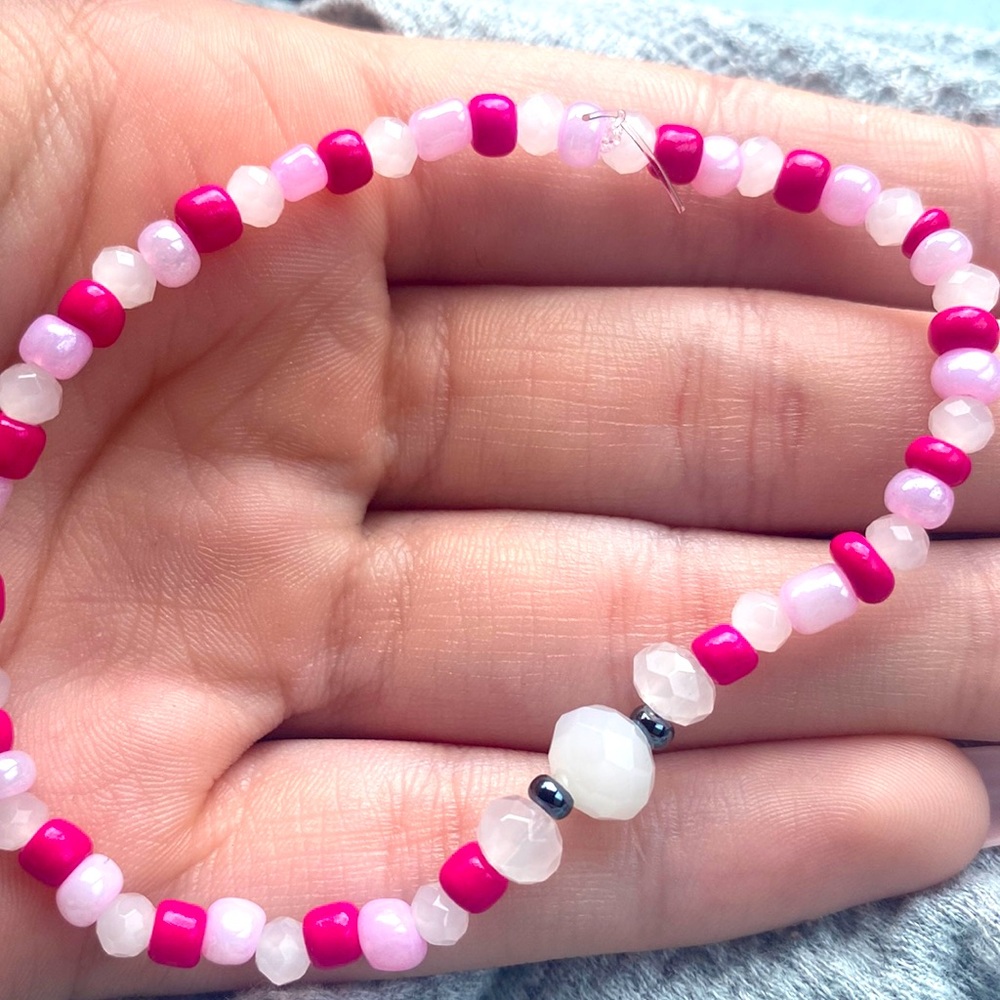 white and pink bracelet